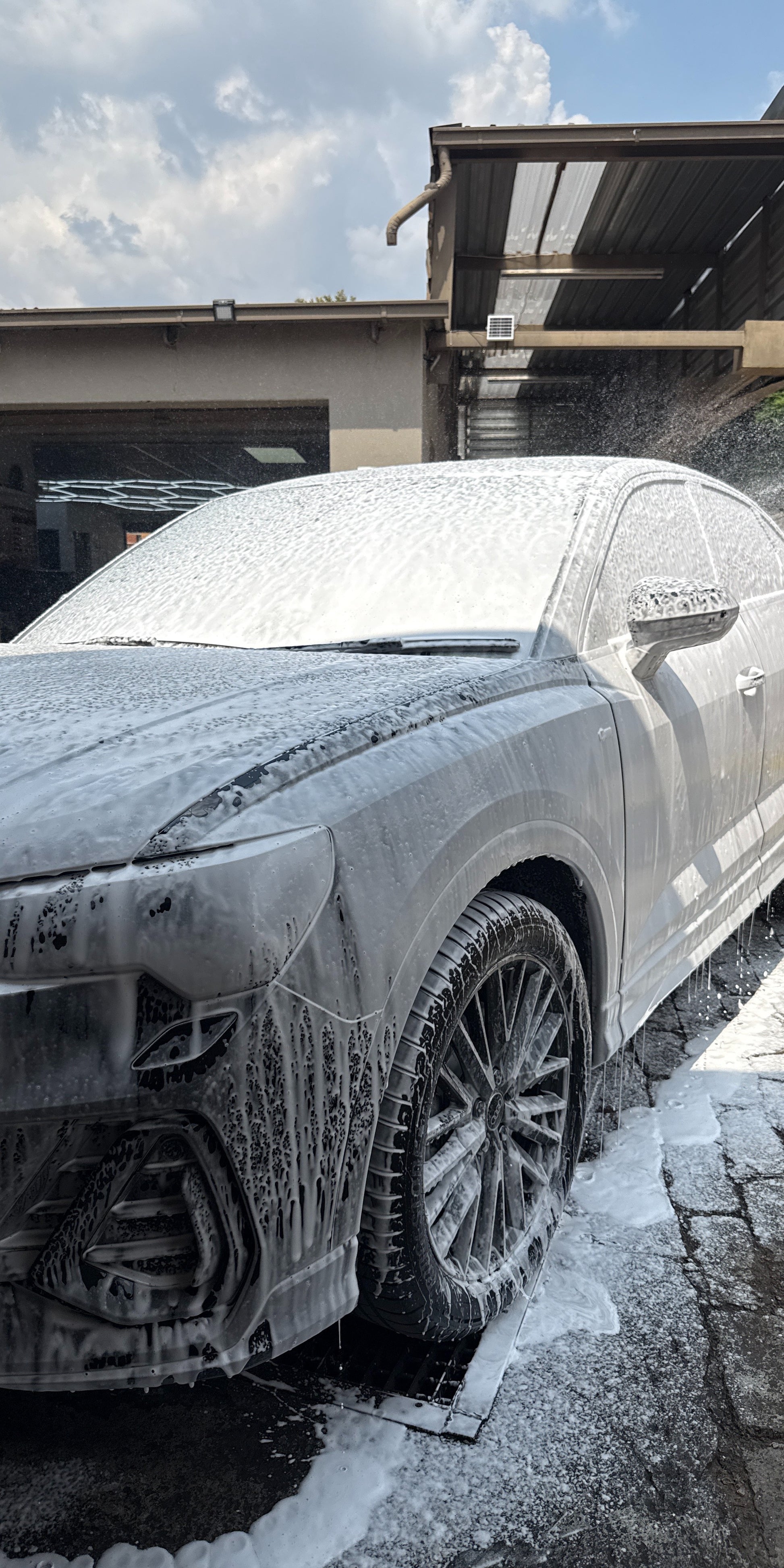 Car covered in snow and ice on a driveway