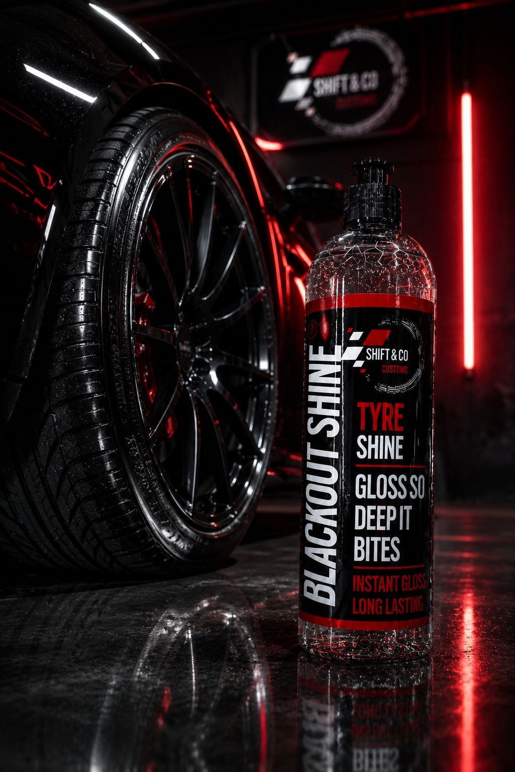 Bottle of 'Blackout Shine' tyre shine with a car wheel in the background