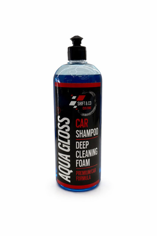 Bottle of AquaGloss car shampoo and cleaning foam on a white background