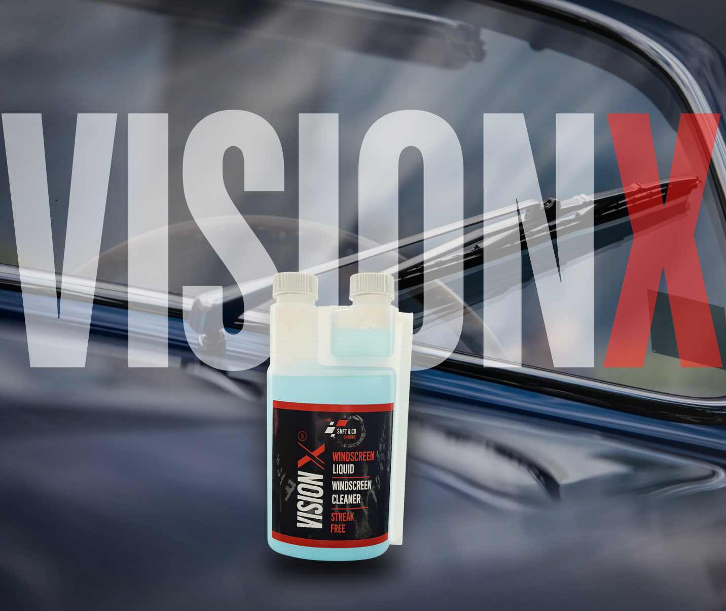 Vision X windshield cleaner bottle with a car window in the background